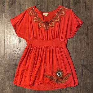 Bright red flowing top